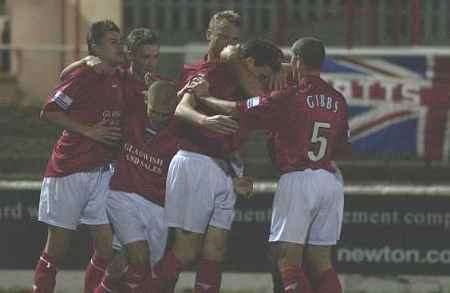 Andy Ford's men celebrate after Steve Perkins puts Fleet ahead