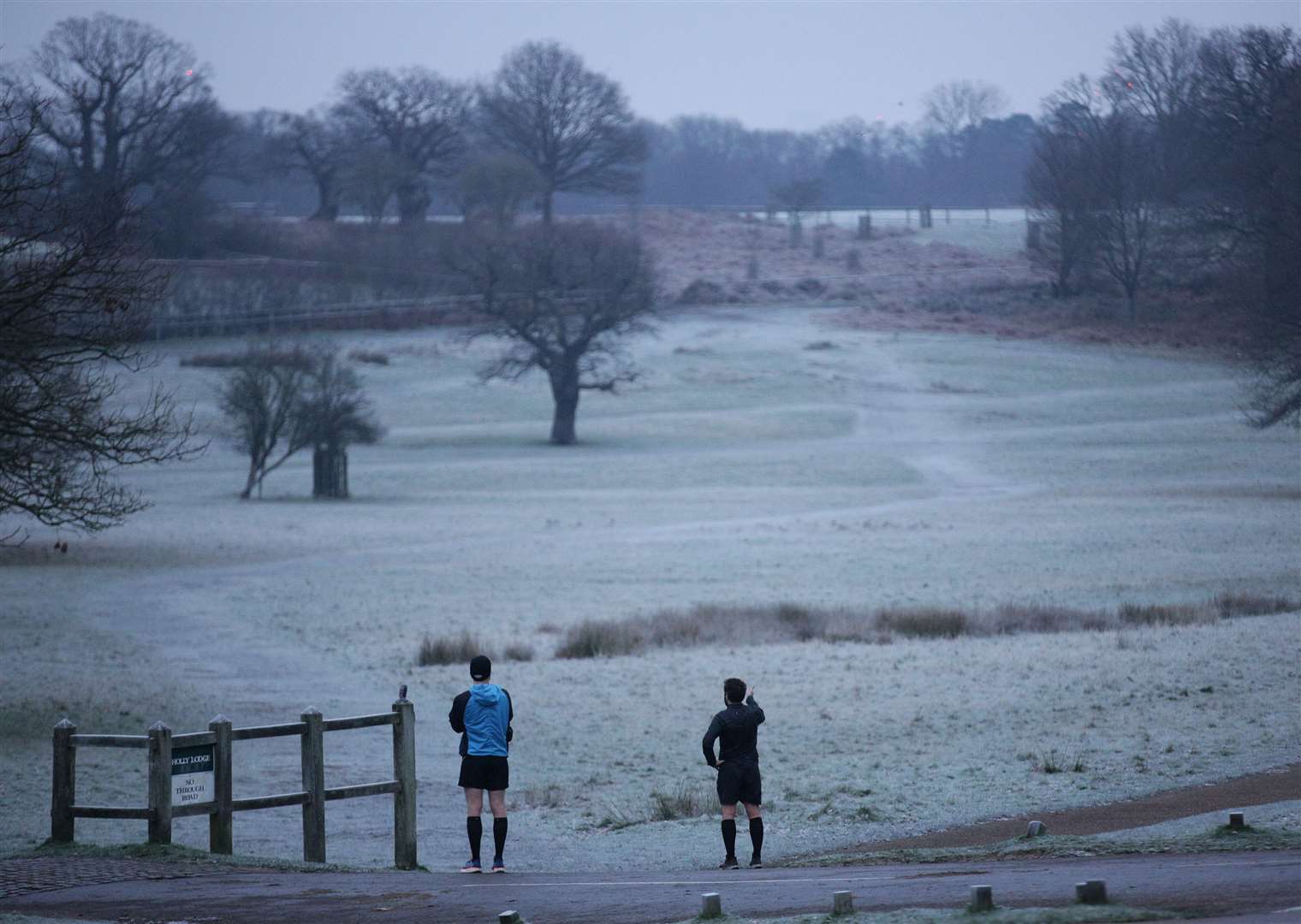 A cold start to the day for joggers in Richmond Park (Yui Mok/PA)