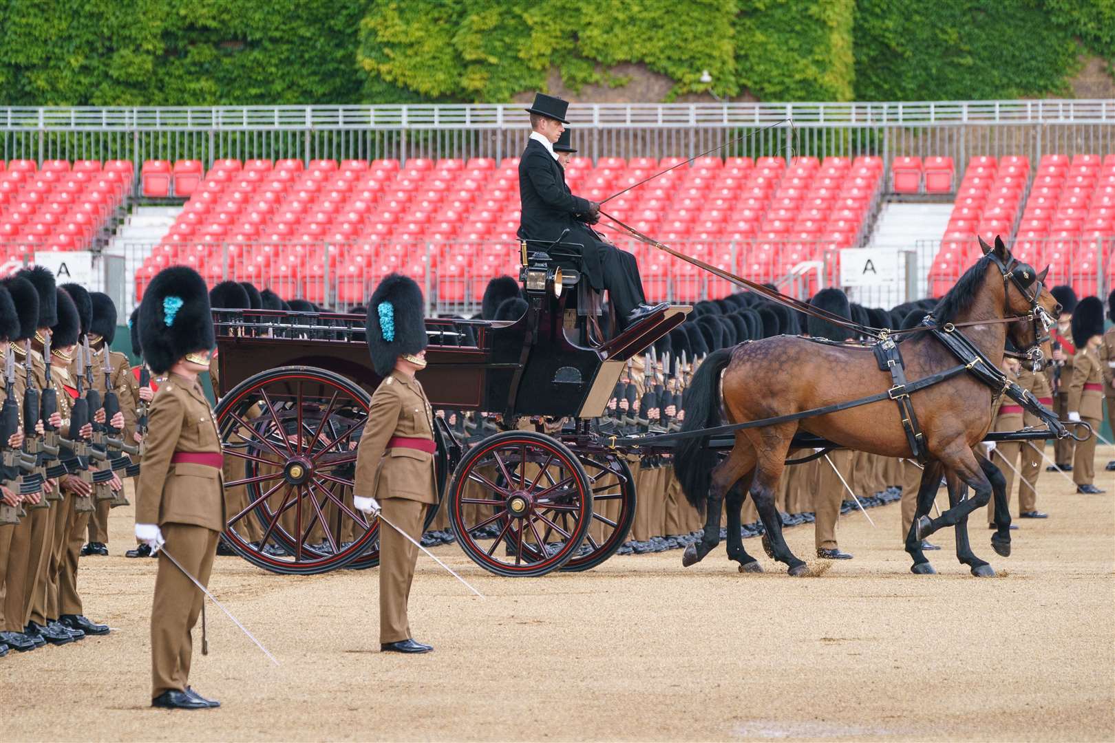 A carriage is driven past troops during the Brigade Major’s Review (Dominic Lipinski/PA)