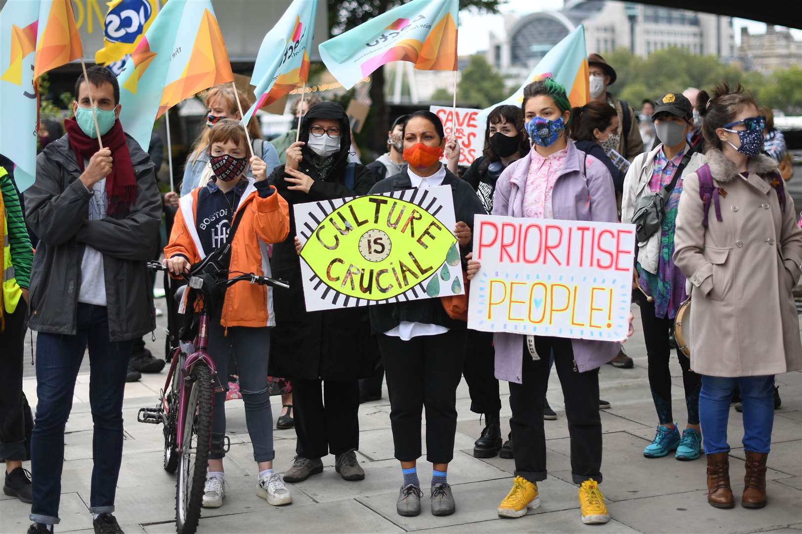 People gathered outside the National Theatre in central London to protest against more than 1,000 redundancies being made along the South Bank (Stefan Rousseau/PA)