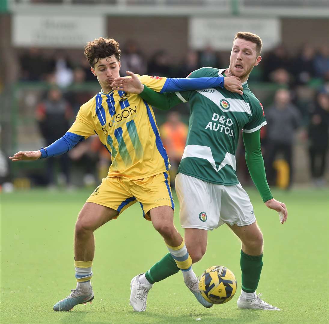 Ashford midfielder Harvey Brand tussles for the ball against Sittingbourne. Picture: Ian Scammell