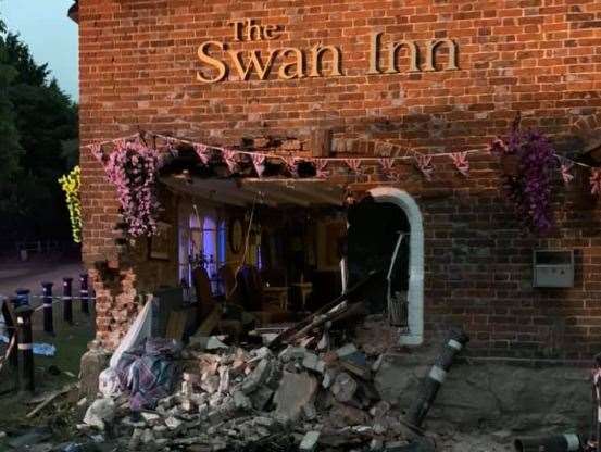 A gaping hole was left in the side of the The Swan Inn following the crash