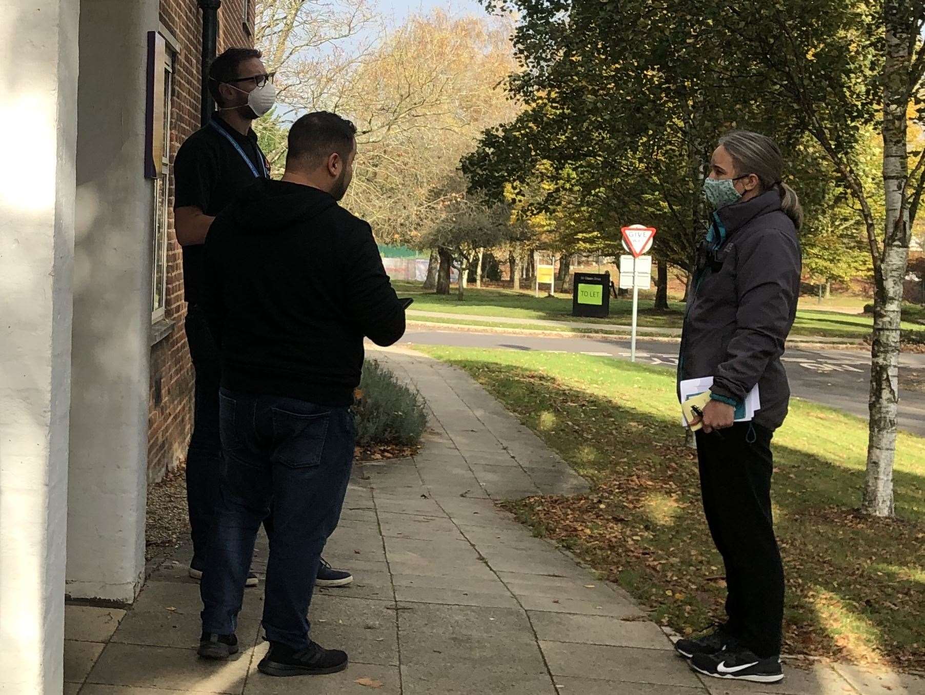 Mr Warwick speaking with KCC officers outside his business as England was placed into another lockdown at the start of November