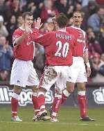 JOB WELL DONE: Charlton celebrate Bryan Hughes' opening goal. Picture: MATT READING