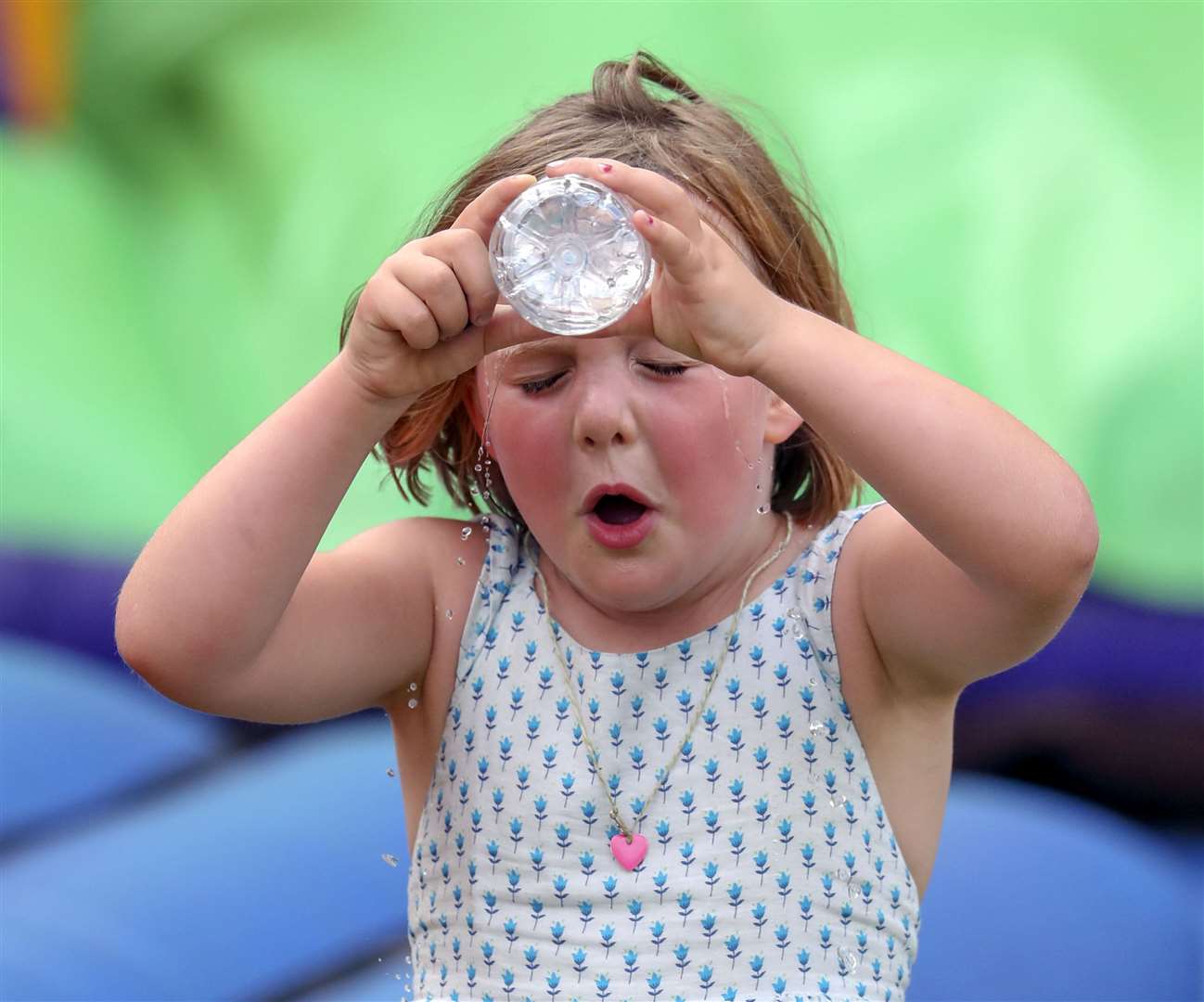 Zara and Mike Tindall’s daughter Mia pours some water over her face at horse trials in 2019 (Steve Parsons/PA)