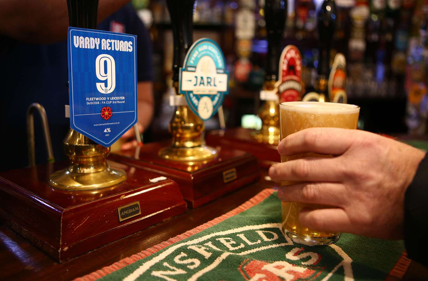 Duty on draught products – or pints pulled in pubs – will be cut by 1.7% (PA)