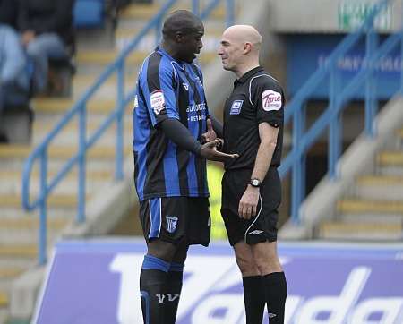 Adebayo Akinfenwa with referee Steve Rushton