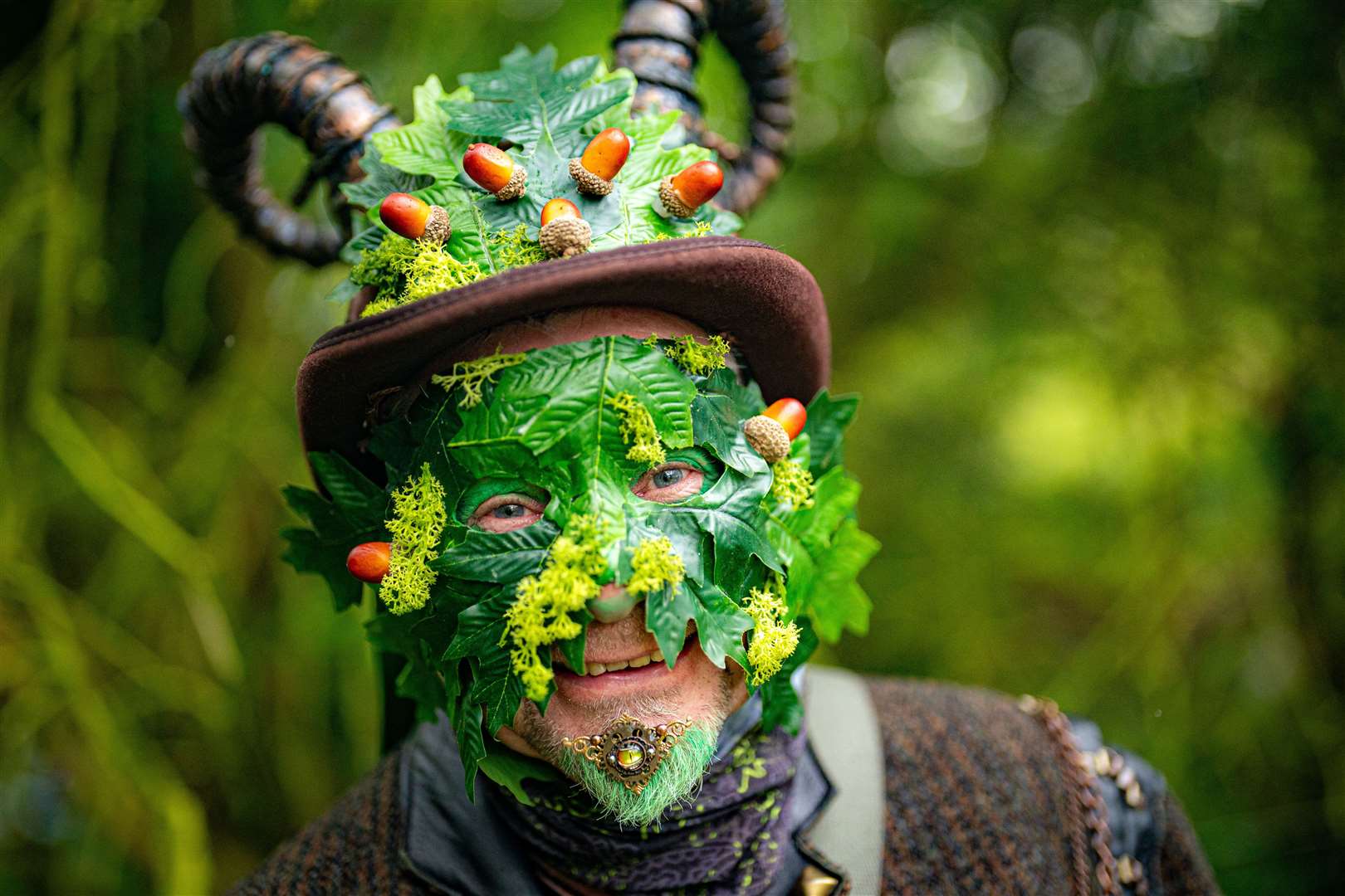 A green man observes a modern interpretation of the ancient Celtic pagan fertility rite of spring (Ben Birchall/PA)