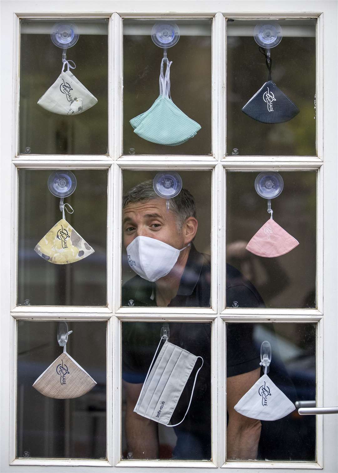 Gavin McAdam wears one of the face masks designed by his Edinburgh pop-up company (Jane Barlow/PA)