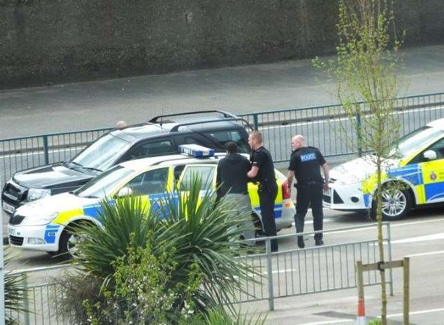 Officers arresting Bennett