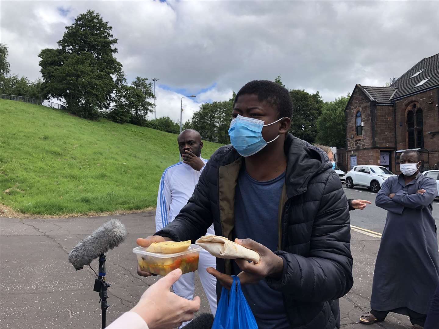 Asylum seeker Mohamed shows a meal he was served at the Tartan Lodge (PA)