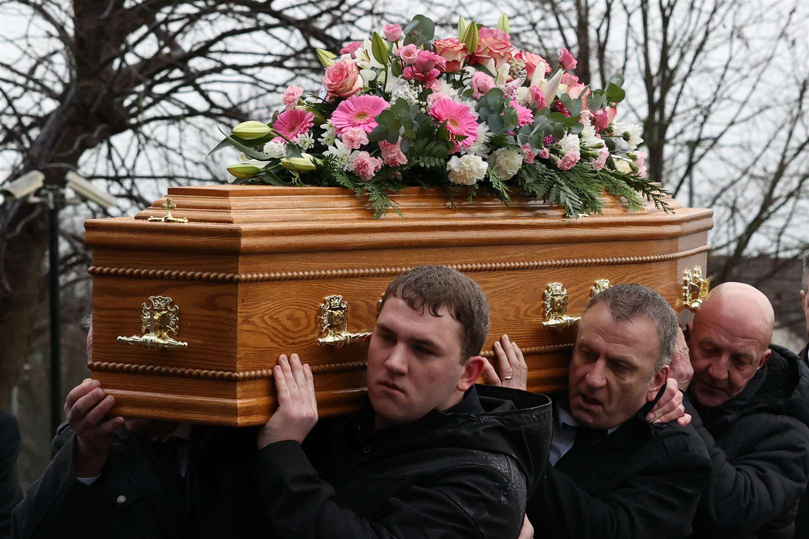 The coffin is carried into the funeral of Karen Cummings (Liam McBurney/PA)