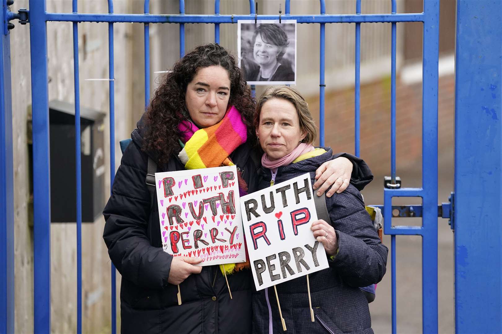 Ellen (left) and Liz (surnames not given) outside the gates to John Rankin Schools in Newbury, Berkshire (Andrew Matthews/PA)