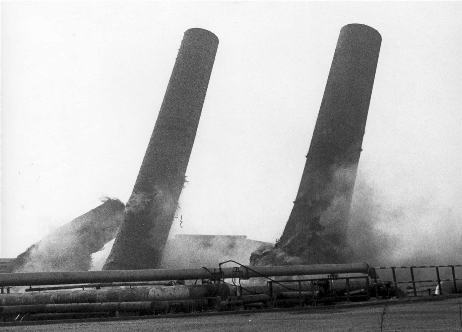 Chimneys on the Isle of Grain being demolished in February 1985