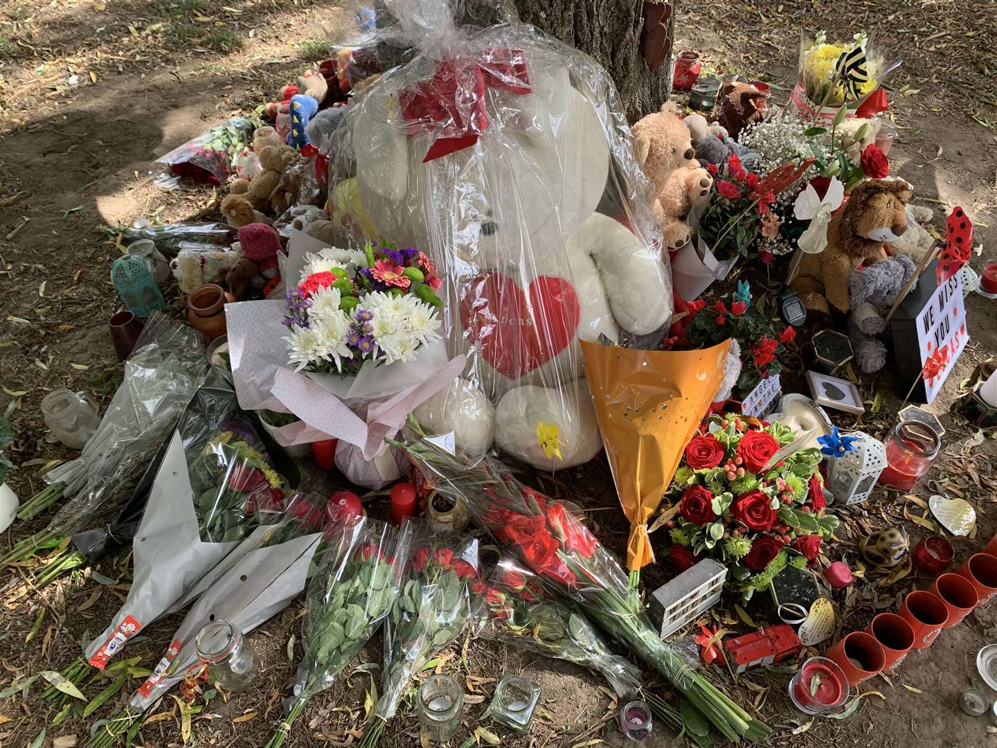 A huge white teddy with Lucas' name is among the first anniversary tributes