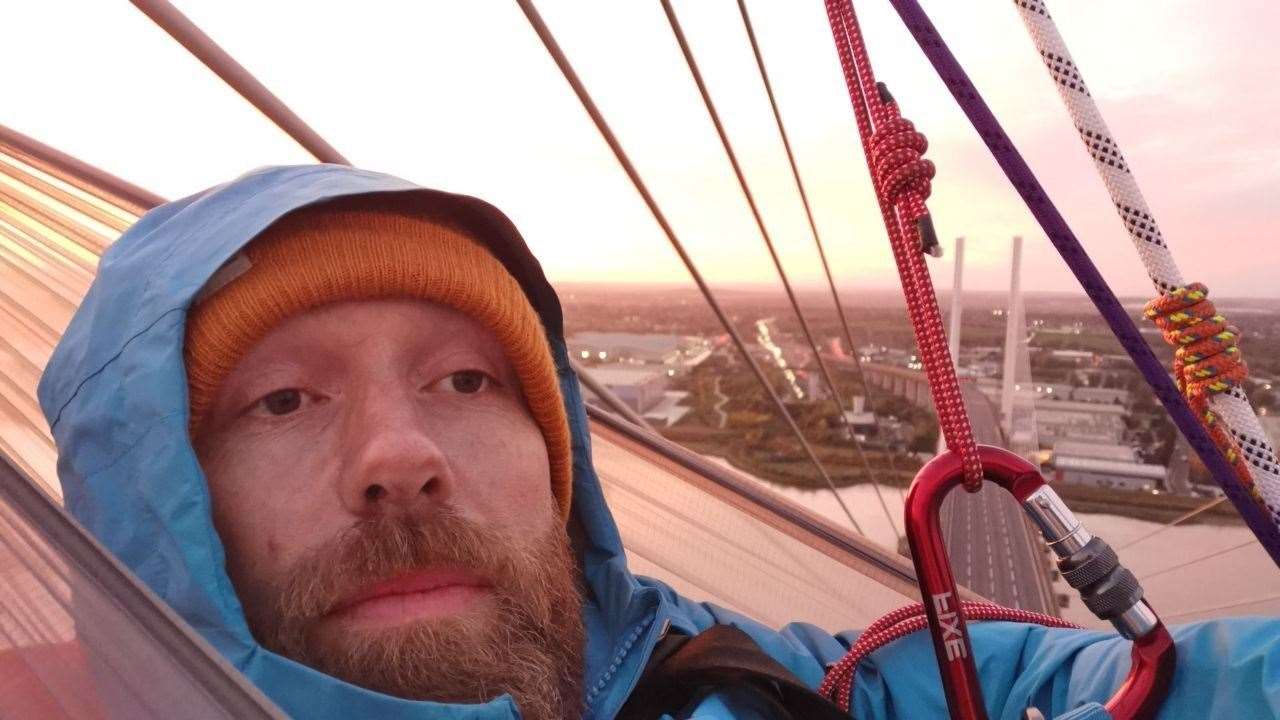 One of the protesters in a hammock on the bridge. Picture: Just Stop Oil