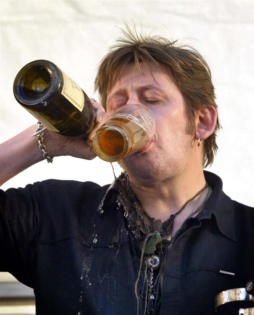 Shane MacGowan of The Pogues, takes a refreshment break (Paul Faith/PA)