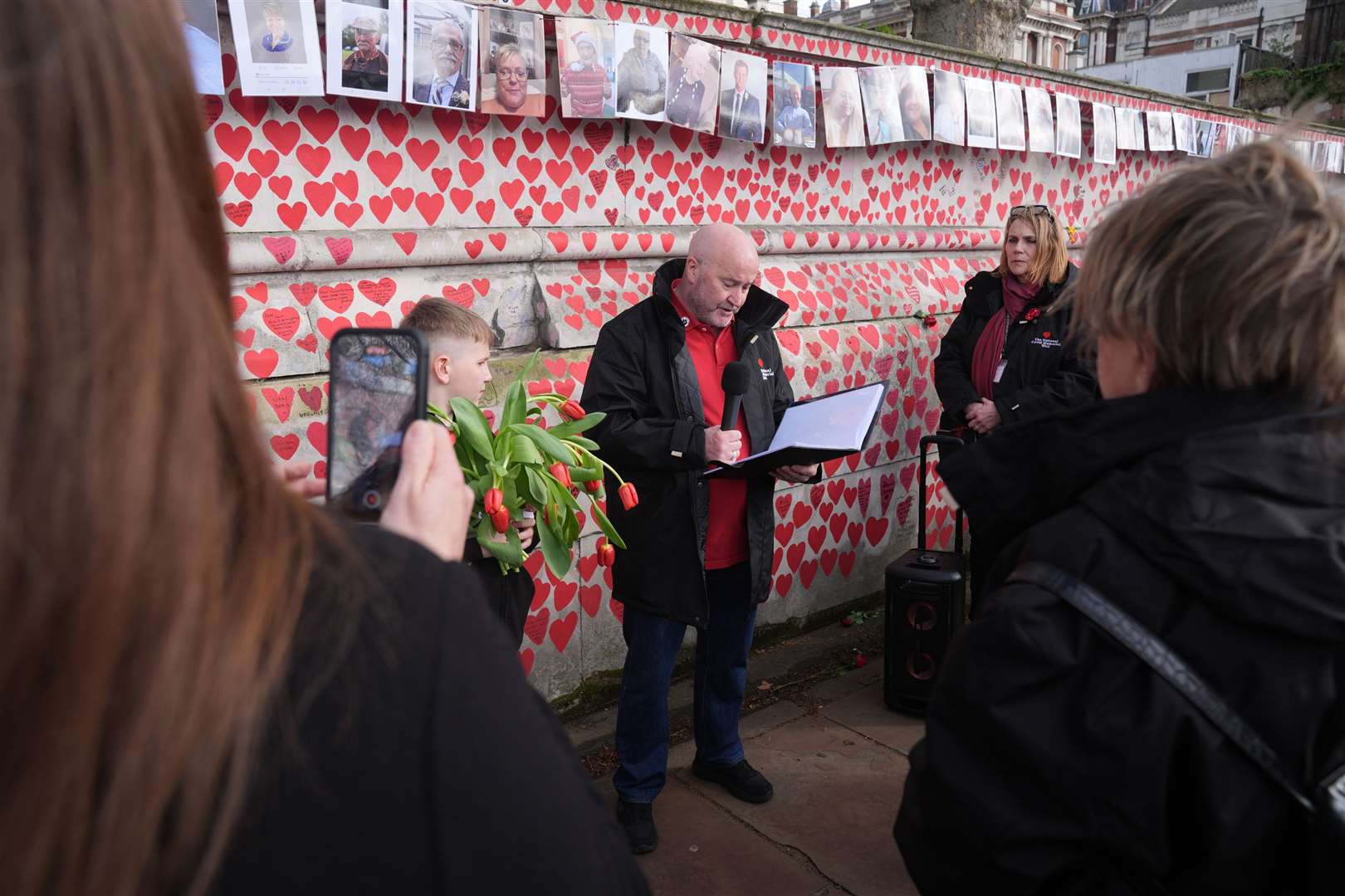 People take part in the memorial service (Lucy North/PA)