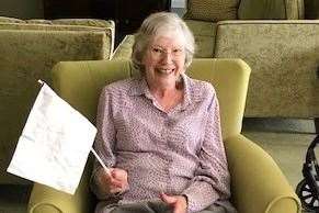 Yvonne Strong, a resident at Wimborne House, Gravesend, enjoys the music by London Fanfare Trumpets