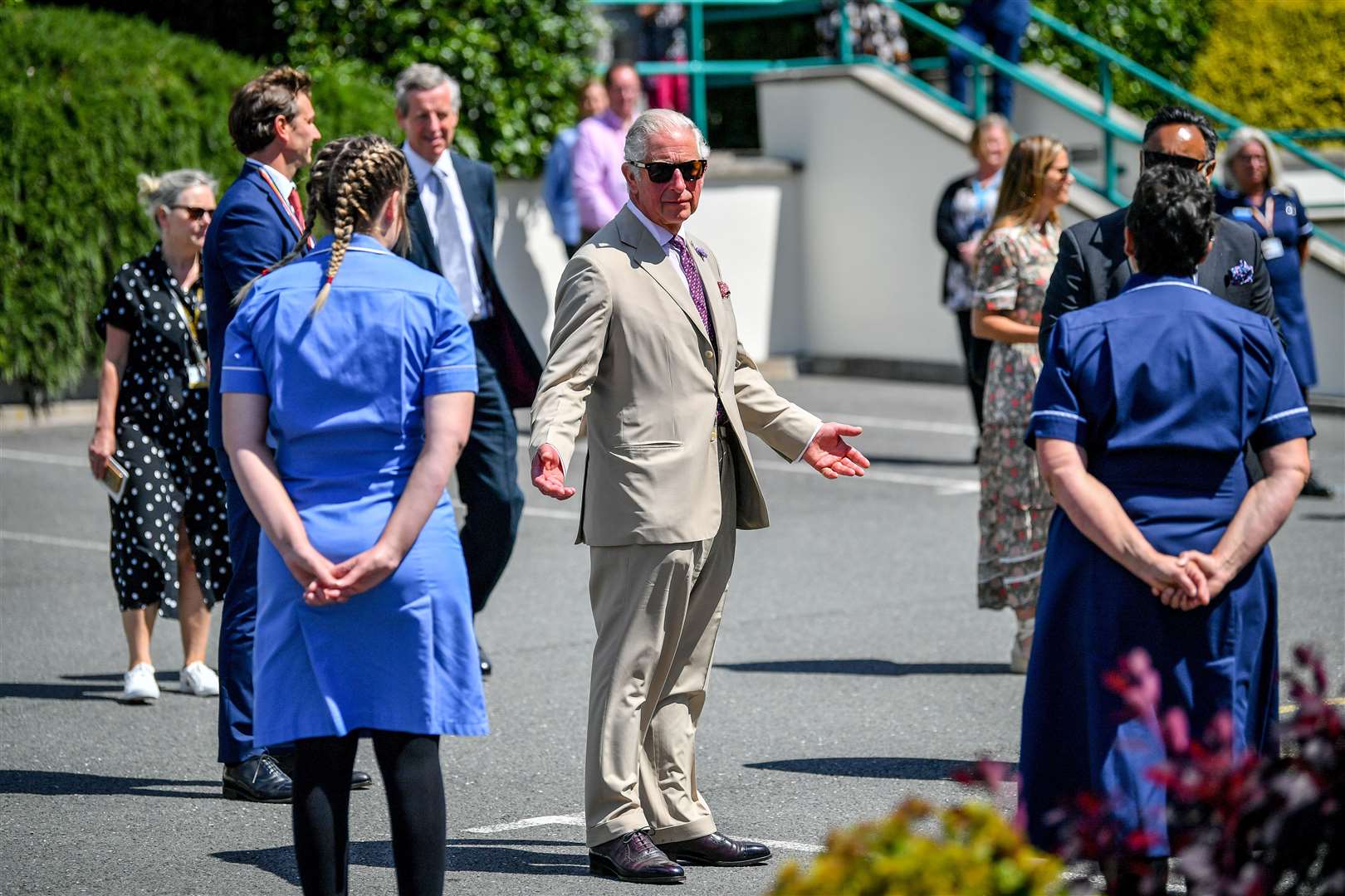 Charles chats to staff from St Austell Healthcare, seen as a model for future GP surgeries (Ben Birchall/PA)