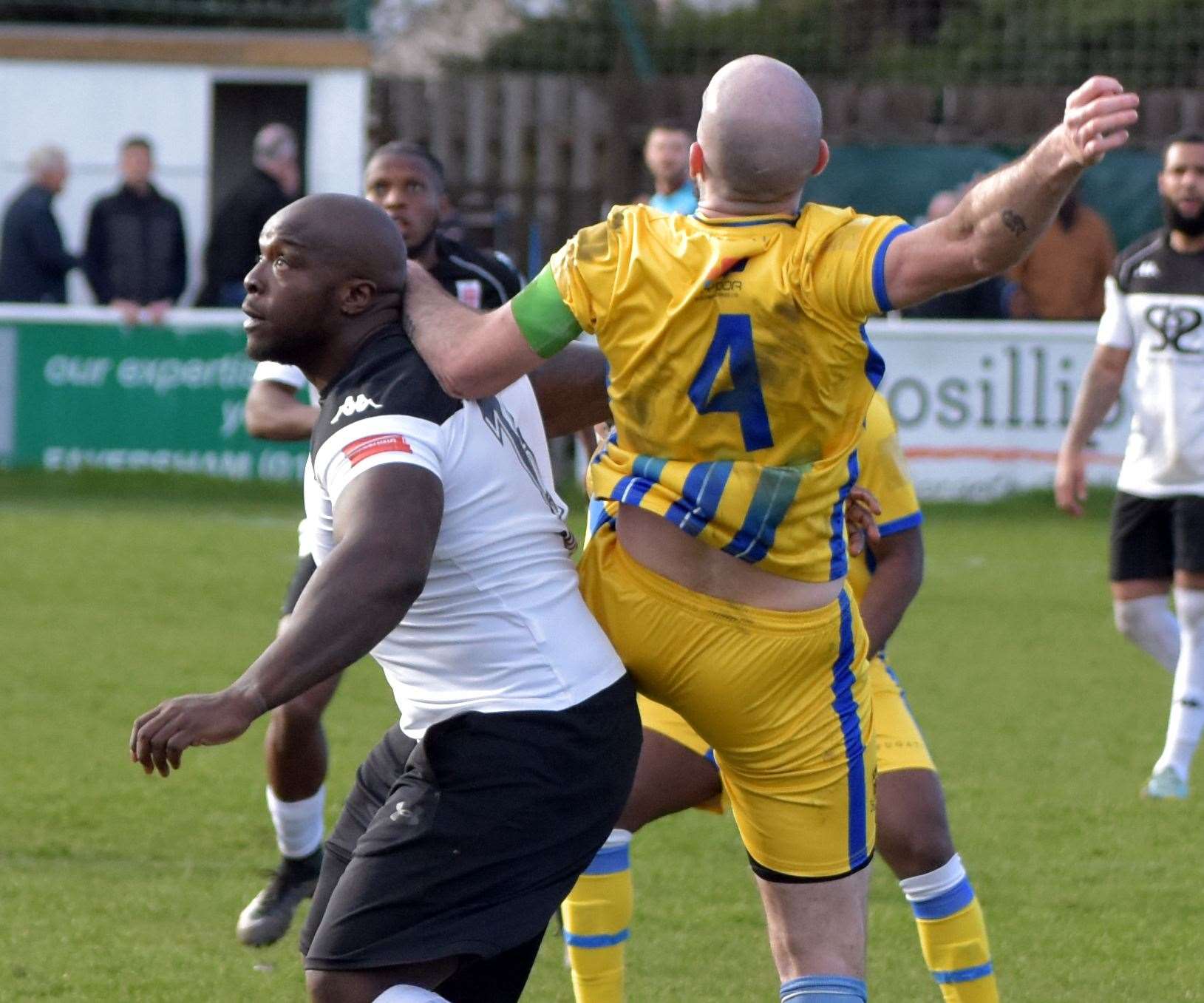 Faversham's Adebayo Akinfenwa and Sittingbourne skipper Joe Ellul amid battle. Picture: Randolph File