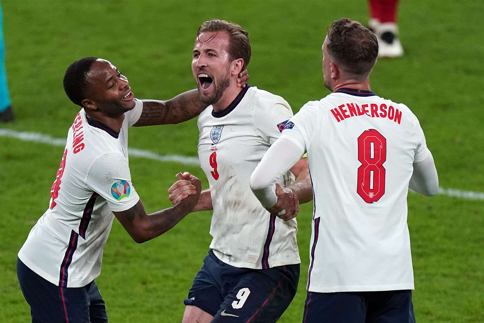 England’s Raheem Sterling, Harry Kane and Jordan Henderson celebrate winning the Euro 2020 semi-final match at Wembley Stadium on July 7 2021 (Mike Egerton/PA)