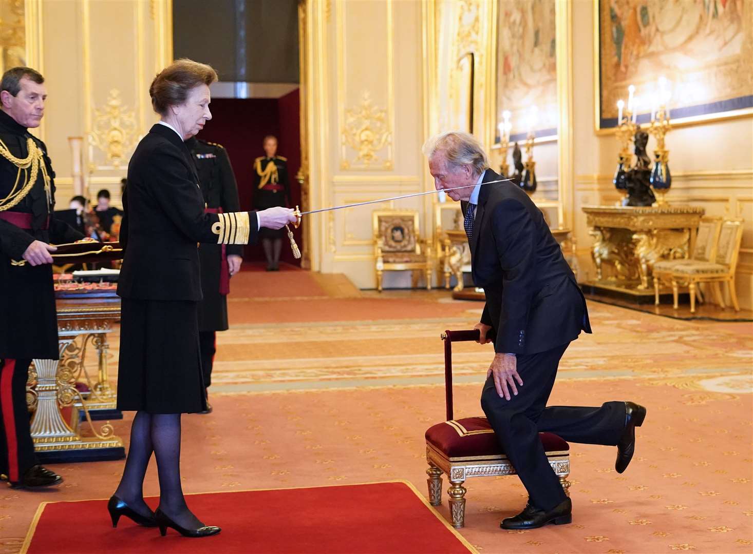 Sir Thomas Hicks (better known as the entertainer Tommy Steele) is made a Knight Bachelor by the Princess Royal at Windsor Castle (PA)