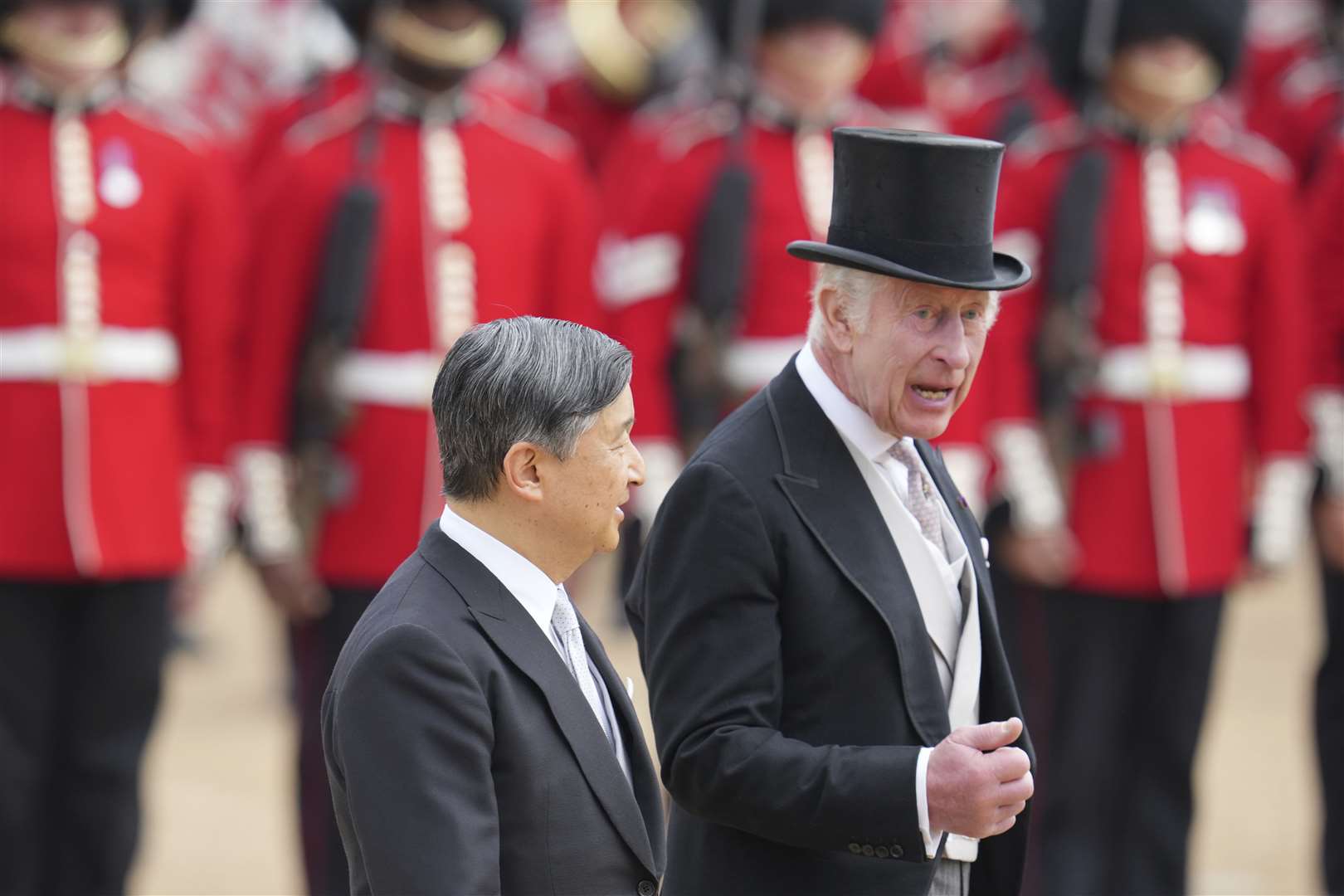 Charles chats to Emperor Naruhito after inspecting the Guard of Honour from members of the Welsh Guards (Kin Cheung/PA)