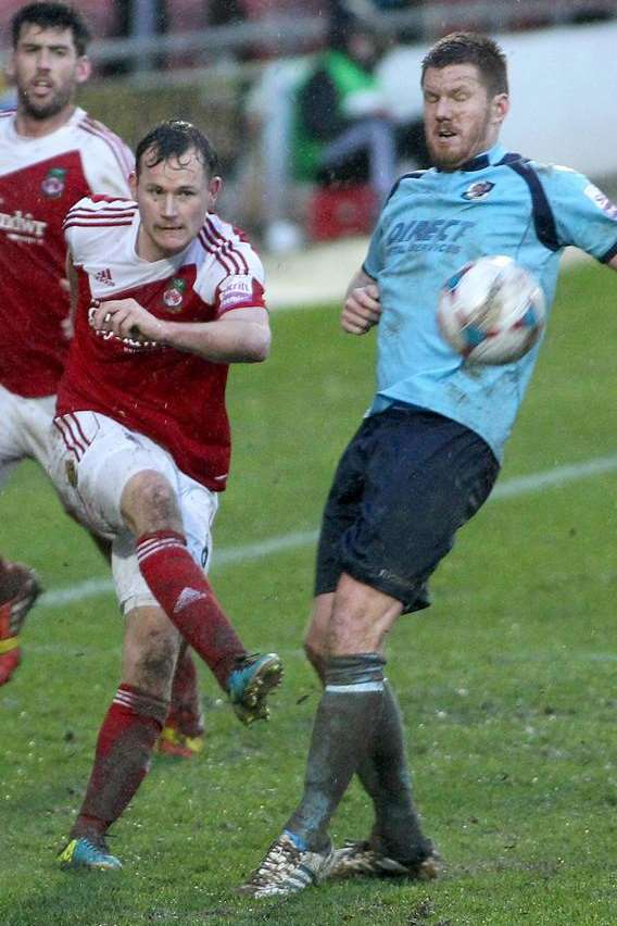 Elliot Bradbrook up against Wrexham's Joe Clarke (Pic: Rick Matthews)