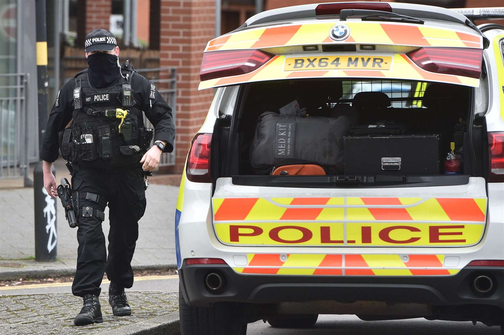 A firearms officer walks to his vehicle in Lee Bank, Birmingham (Ben Birchall/PA)