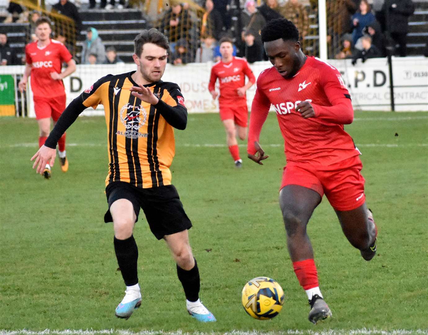 Folkestone’s Kane Penn closes down on an away player. Picture: Randolph File