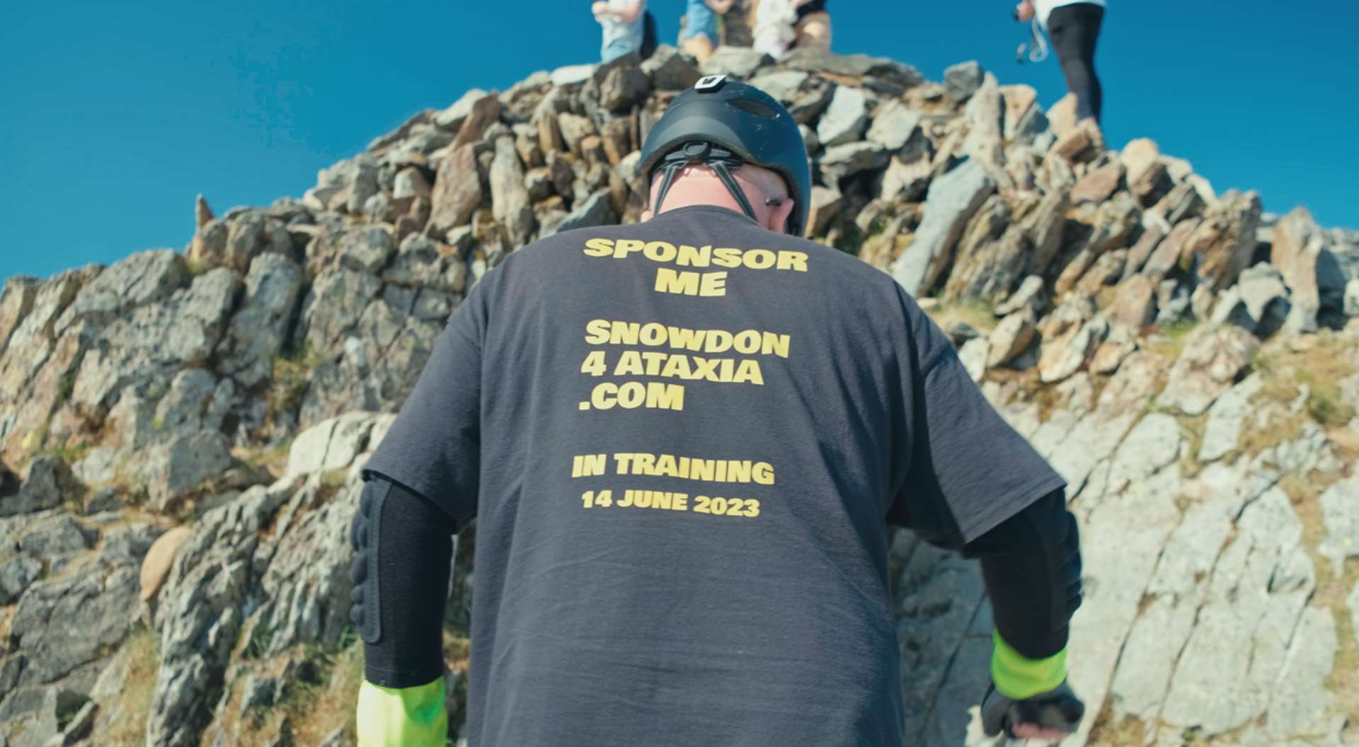 Ben Spencer climbing up Snowdon (Viktor Elzer/Ataxia UK/PA)