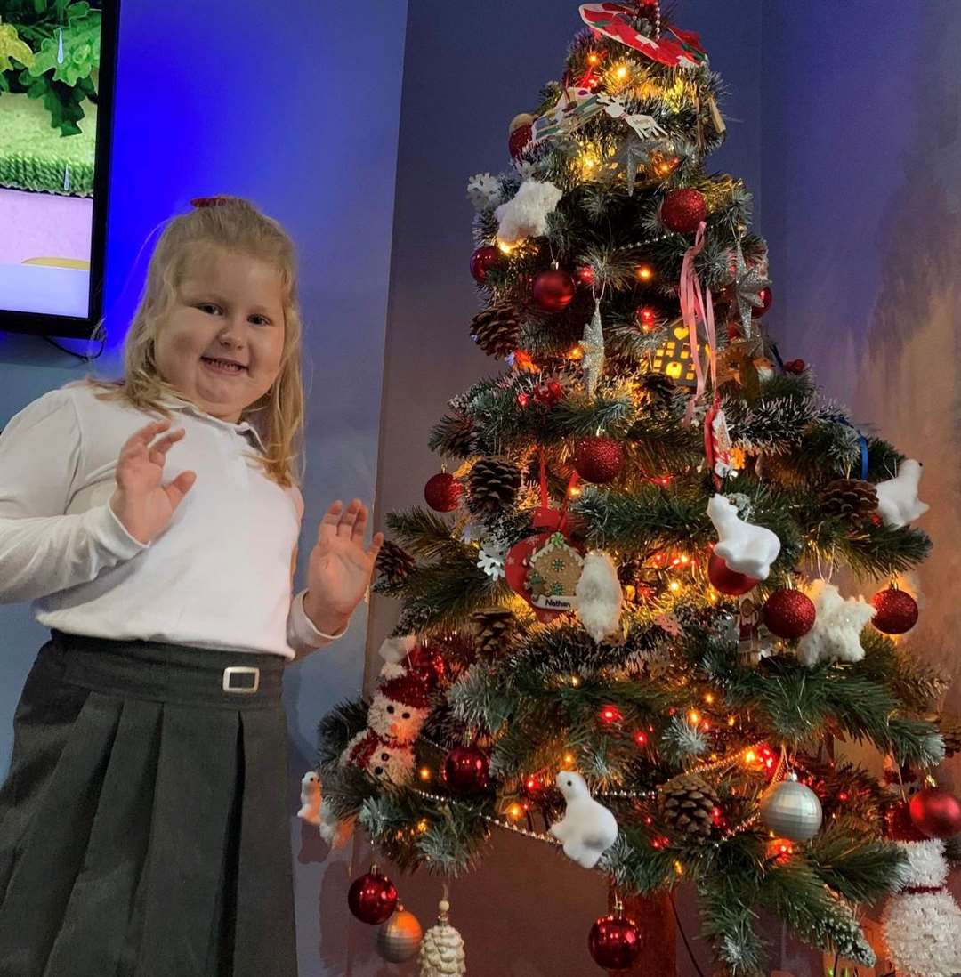 Maya Siek at home in Margate with the Christmas tree she decorated