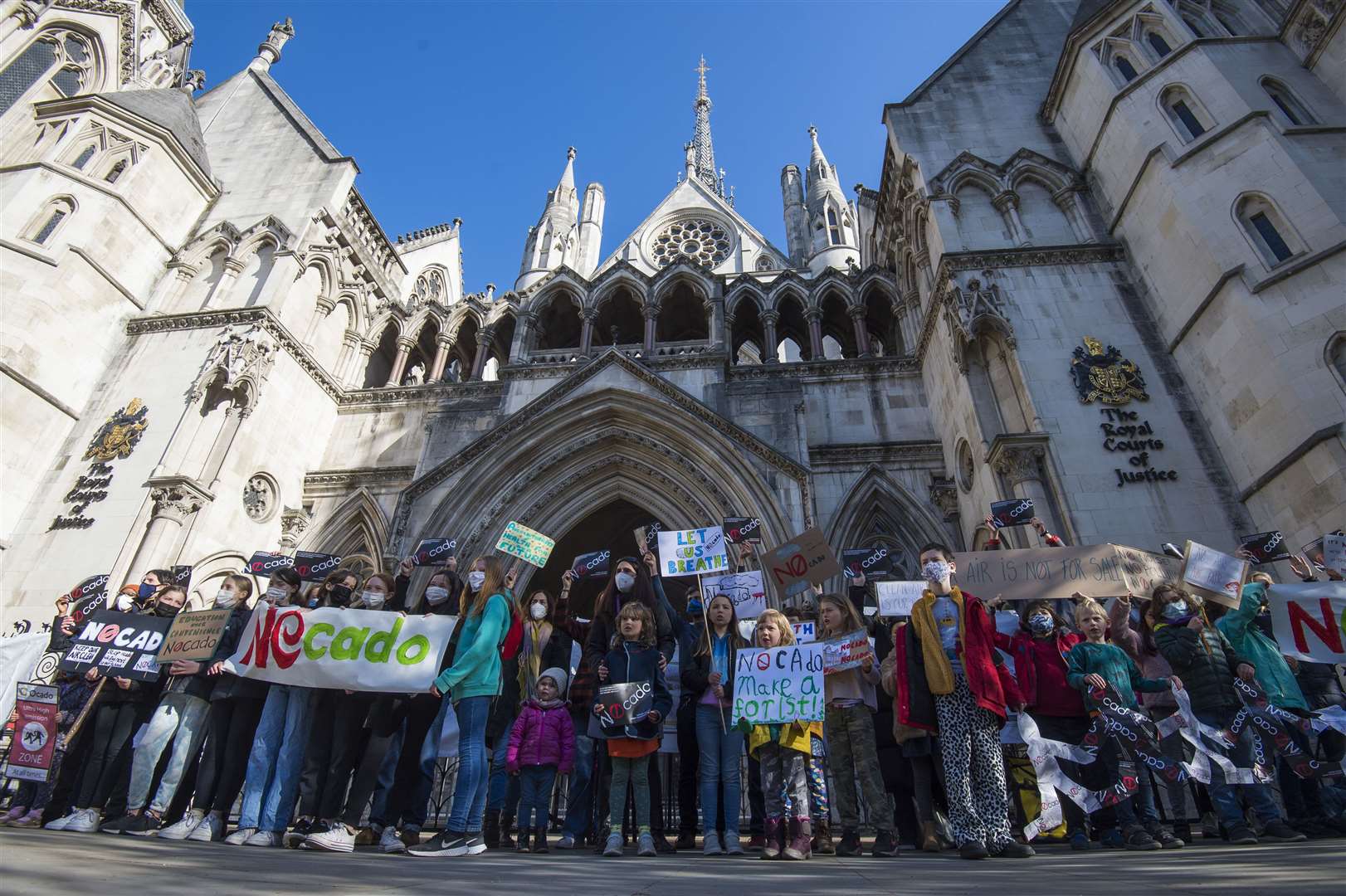 Pupils from Yerbury Primary School protest outside the High Court (Kirsty O’Connor/PA)