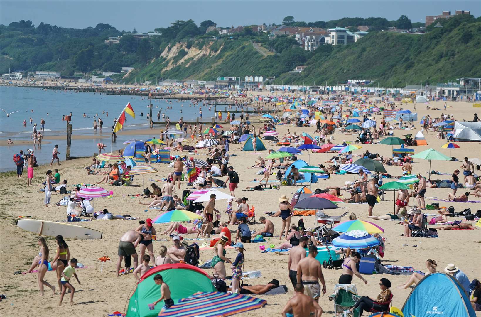 People enjoying the hot weather at Bournemouth Beach in Dorset (Andrew Matthews/PA)