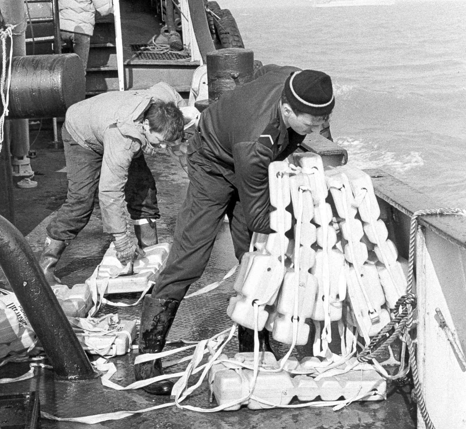 Crews clear away the life jackets which few had the chance to use such was the speed of the vessel's capsizing