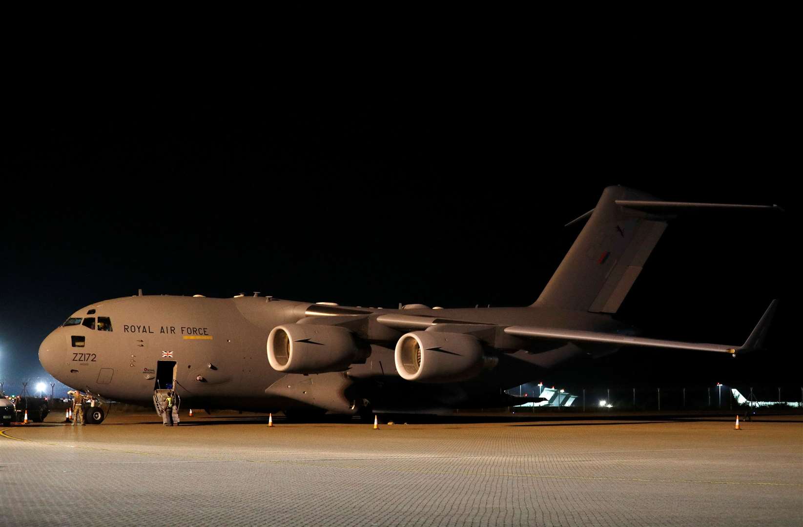 British military personnel depart a C-17 aircraft at RAF Brize Norton, Oxfordshire after the final airlift from Afghanistan (Peter Nicholls/PA)