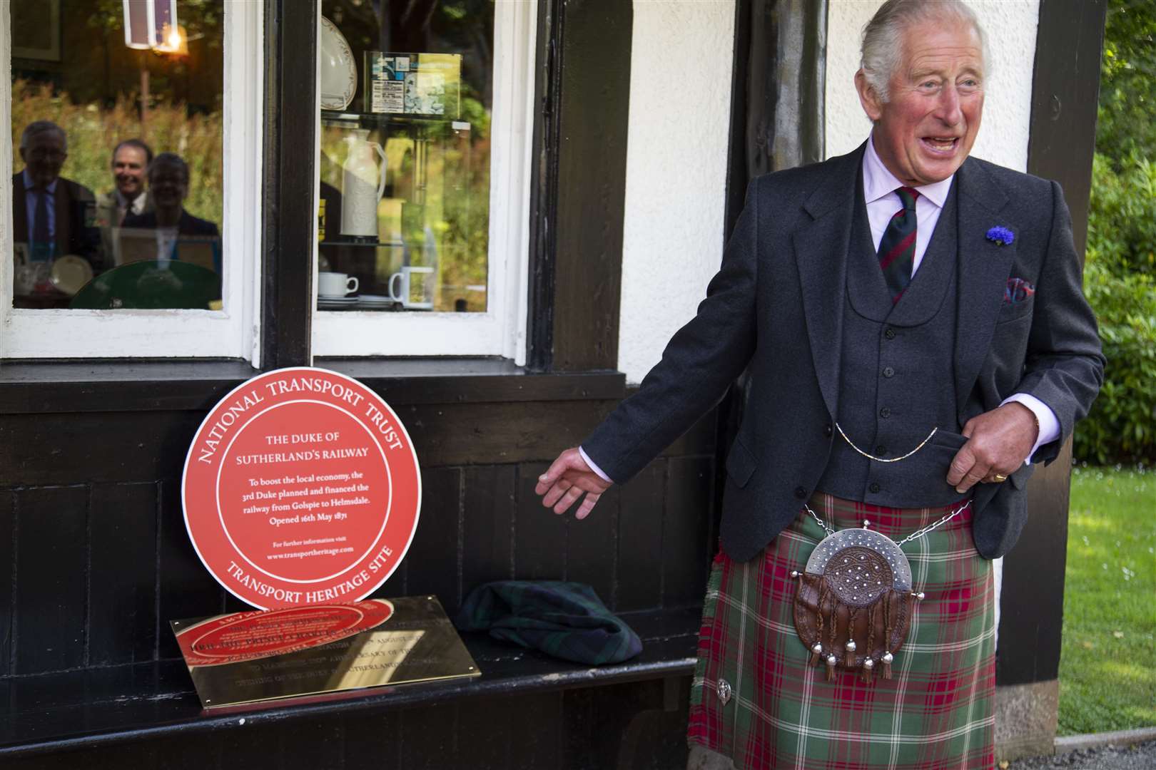 Charles shares a joke as he unveils two plaques during his visit to the station (John Baikie)