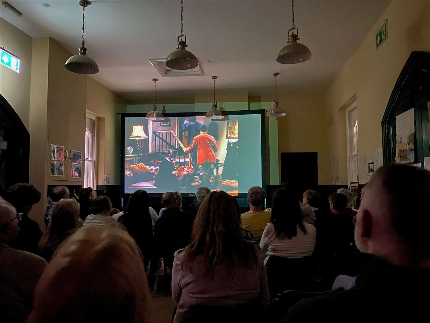 Villagers enjoying a film inside the new community hub