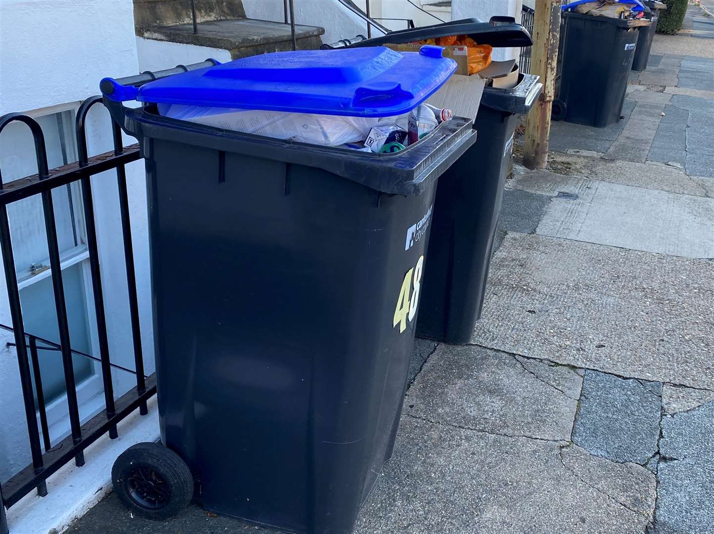 Uncollected recycling bins stuffed to the brim on Whitstable Road, Canterbury