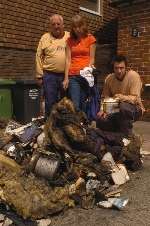 Paul, Linda and son Steve survey the damage