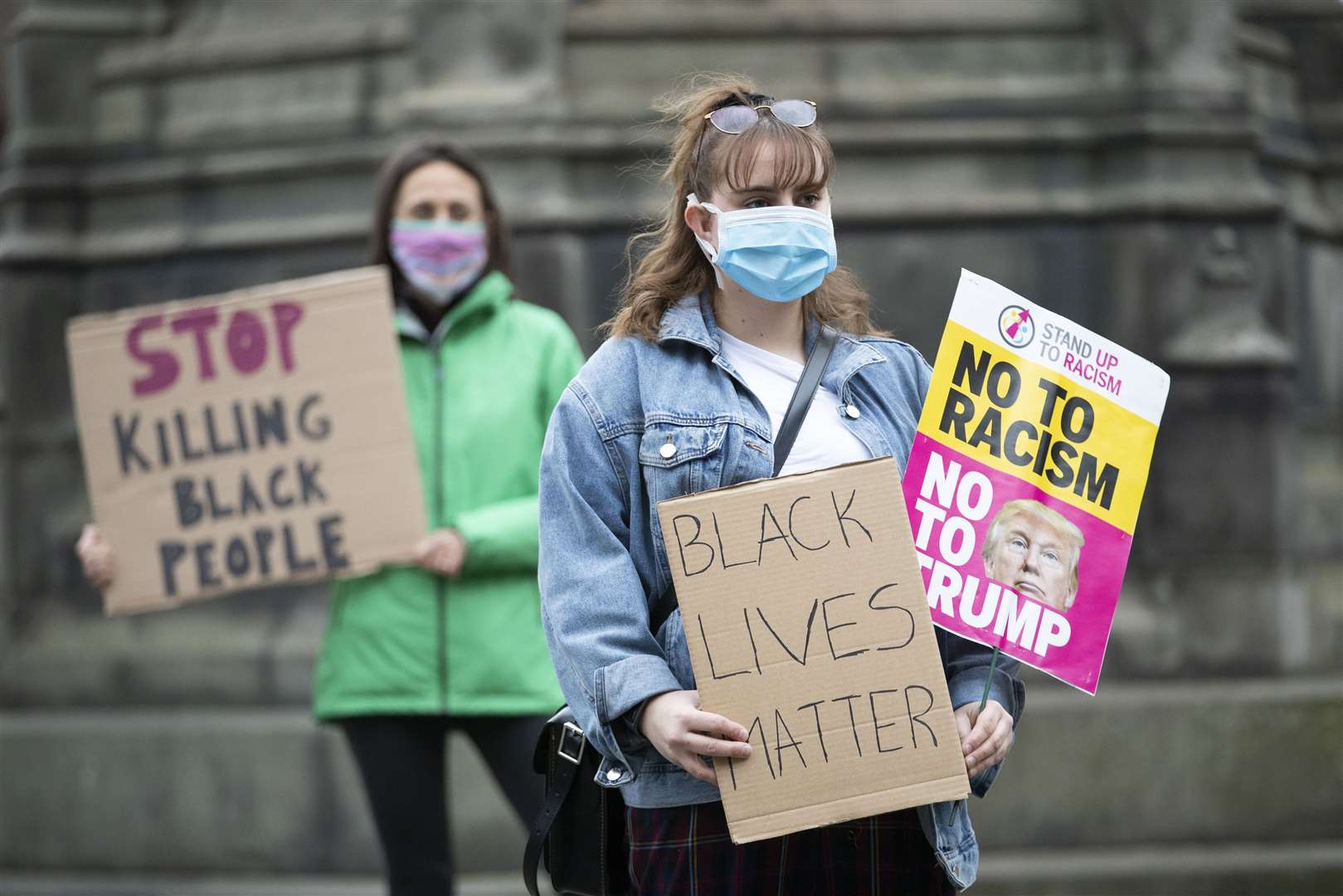 The protest was organised by Stand Up To Racism Scotland outside St Giles’ Cathedral in Edinburgh (Jane Barlow/PA)