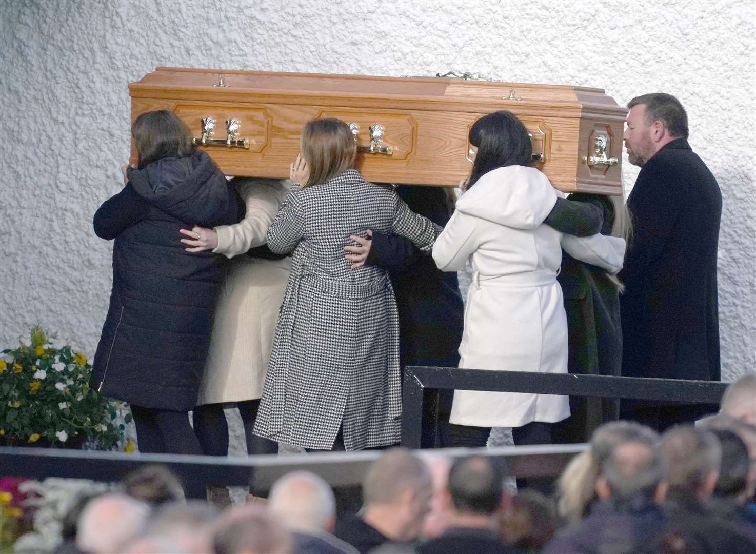 The coffin of Hugh Kelly is carried in to St Michael’s Church, in Creeslough, for his funeral mass (Brian Lawless/PA)