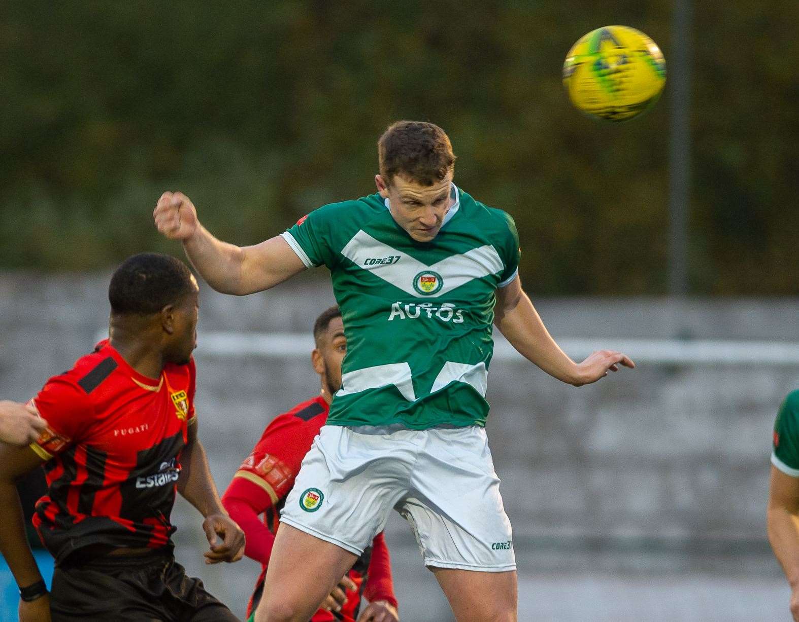 Josh Wisson heads home Ashford's winning goal in their 1-0 victory over rivals Sittingbourne on Saturday. Picture: Ian Scammell