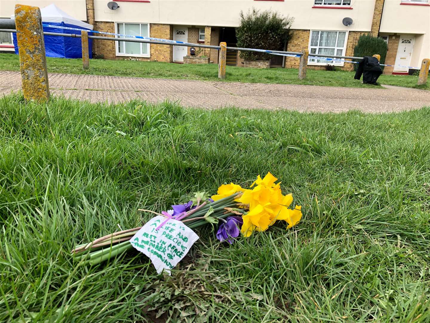 Flowers at Cambridge Crescent after a man was found dead