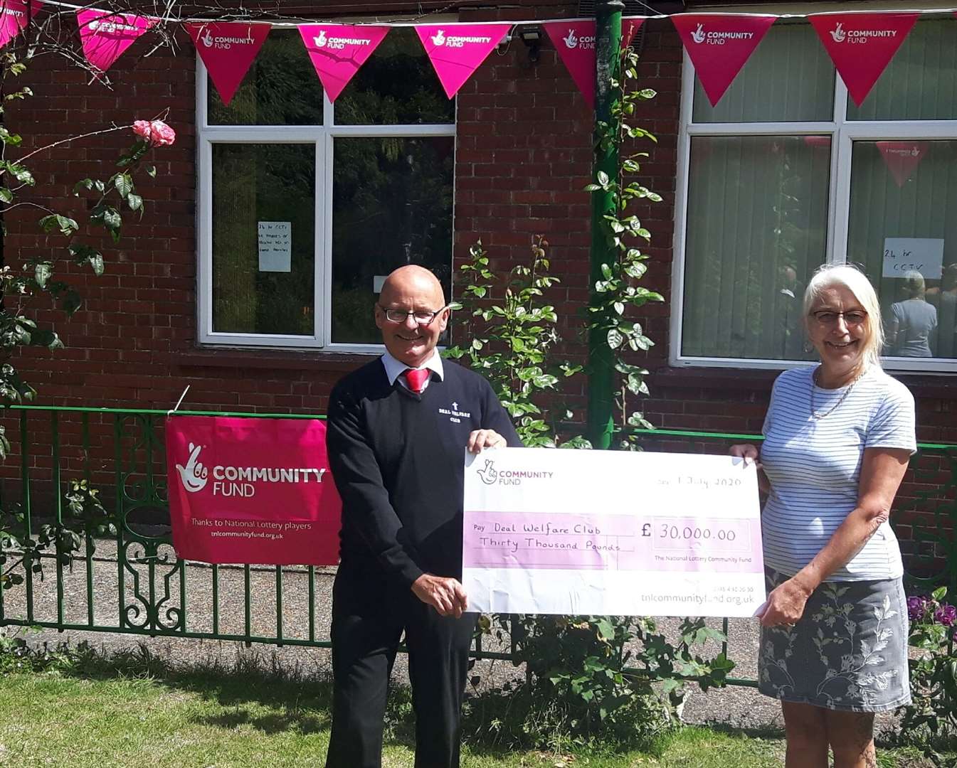 Deal Welfare Club chairman Lee Bowman with treasurer Diane Ashmore with the £30,000 cheque from the National Lottery to pay for meals for financially vulnerable families