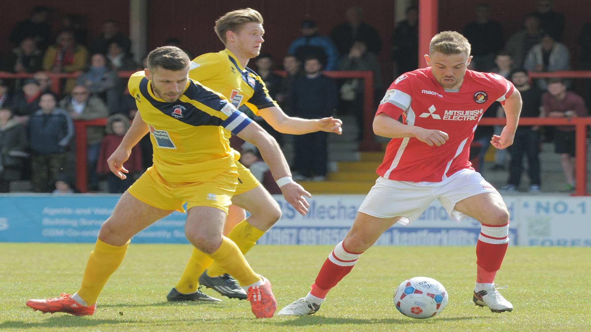 Matt Godden gets the wrong side of Eastbourne captain Craig Stone Picture: Ruth Cuerden