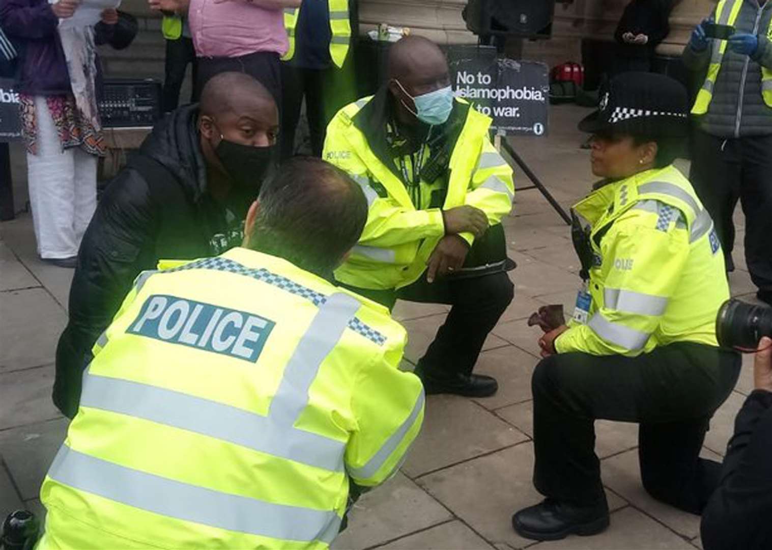 Police taking the knee during a Black Lives Matter rally in Victoria Square, Birmingham (Shajidur Rahman/Twitter/PA)