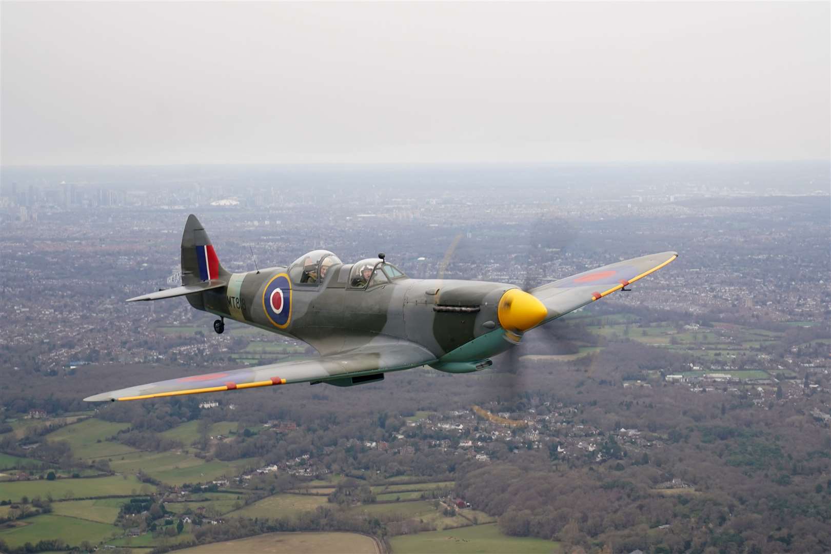 Jack Hemmings flew the Spitfire plane to mark 80th anniversary of the military charity Mission Aviation Fellowship (Gareth Fuller/PA)