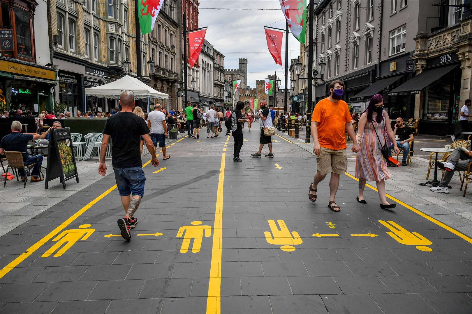 Yellow markings along the pedestrianised area of Cardiff city centre aid social distancing (Ben Birchall/PA)